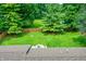 Spacious backyard featuring a well-maintained lawn and a cozy deck area at 4132 Tincher Rd, Indianapolis, IN 46221