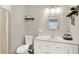 Bathroom featuring a vanity, decorative mirror, and storage shelves at 4132 Tincher Rd, Indianapolis, IN 46221