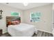 A cozy bedroom features a wooden accent headboard, soft lighting, and a neutral color scheme at 4132 Tincher Rd, Indianapolis, IN 46221