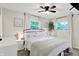 A bright bedroom features large windows, stylish decorations, and minimalist decor at 4132 Tincher Rd, Indianapolis, IN 46221