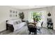 Charming dining area featuring a futon and natural light from the large window at 4132 Tincher Rd, Indianapolis, IN 46221