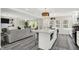 This kitchen features an open design, an island with seating, and opens to the living area at 4132 Tincher Rd, Indianapolis, IN 46221
