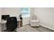 A functional home office area is furnished with a desk, computer, and comfortable chair at 4132 Tincher Rd, Indianapolis, IN 46221