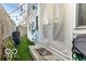 Outdoor area featuring a small patio and artificial turf at 48 E Palmer St, Indianapolis, IN 46225