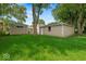 Spacious backyard featuring a well-maintained lawn and additional structures offering extra storage at 508 W 38Th St, Indianapolis, IN 46208