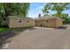 Large backyard with mature trees, and a paved driveway at 508 W 38Th St, Indianapolis, IN 46208