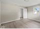 This spacious bedroom features neutral walls, modern flooring, and a bright window at 508 W 38Th St, Indianapolis, IN 46208