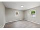 Spacious bedroom with light gray walls, modern flooring, and ample natural light from dual windows at 508 W 38Th St, Indianapolis, IN 46208