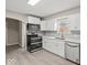 Beautiful kitchen featuring stainless steel appliances, white cabinets, and updated countertops at 508 W 38Th St, Indianapolis, IN 46208
