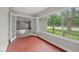 Bright sunroom offering french doors, a large window, and tile floors at 508 W 38Th St, Indianapolis, IN 46208