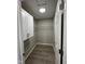 Bright walk-in closet features white cabinets, wire shelving, and wood-look floors at 508 W 38Th St, Indianapolis, IN 46208