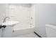 Clean bathroom featuring white sink, toilet, and shower tub combination at 523 Patterson Rd, Columbus, IN 47203