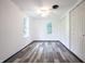 Inviting bedroom with modern flooring, natural light, and a ceiling fan at 523 Patterson Rd, Columbus, IN 47203
