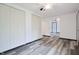 Open bedroom with modern flooring, closet space, and an inviting atmosphere at 523 Patterson Rd, Columbus, IN 47203