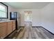 Bright kitchen has stainless steel appliances, wood cabinets and durable vinyl floors at 523 Patterson Rd, Columbus, IN 47203