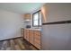 Bright kitchen has stainless steel appliances, wood cabinets and durable vinyl floors at 523 Patterson Rd, Columbus, IN 47203