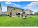Lush backyard features a well-manicured lawn, patio seating, and an outdoor basketball hoop at 5306 Lavender Dr, Plainfield, IN 46168
