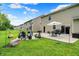 Lush backyard features a well-manicured lawn and a patio seating area with outdoor furniture at 5306 Lavender Dr, Plainfield, IN 46168