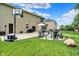 Spacious backyard features a well-manicured lawn, patio seating, and an outdoor basketball hoop at 5306 Lavender Dr, Plainfield, IN 46168