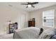 Comfortable bedroom featuring neutral-toned walls, a ceiling fan, and a cozy bed at 5306 Lavender Dr, Plainfield, IN 46168