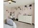 Stylish bedroom features a vanity, dresser, and a soft, inviting bed at 5306 Lavender Dr, Plainfield, IN 46168