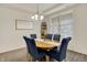 Bright dining room featuring a wood table with seating for six and natural light from a large window at 5306 Lavender Dr, Plainfield, IN 46168