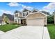 Charming two-story home with a two car garage, stone accents, neutral siding, and inviting curb appeal at 5306 Lavender Dr, Plainfield, IN 46168