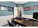 Inviting home office with dark wood desk, sports decor and neutral walls at 5306 Lavender Dr, Plainfield, IN 46168