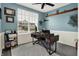 Home office with stylish desk, decor shelving, and large window letting in natural light at 5306 Lavender Dr, Plainfield, IN 46168