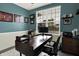 Home office with modern desk, comfortable chair, and large window offering natural light at 5306 Lavender Dr, Plainfield, IN 46168