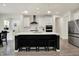 Bright kitchen featuring a kitchen island with quartz countertop, stainless appliances and modern light fixtures at 5306 Lavender Dr, Plainfield, IN 46168