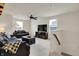 Spacious living room offers comfortable seating, natural light, and modern ceiling fan at 5306 Lavender Dr, Plainfield, IN 46168