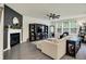 Modern living room featuring a fireplace and built-in TV console for ample entertainment space at 5306 Lavender Dr, Plainfield, IN 46168