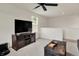 Large entertainment center in living room with comfortable seating, ceiling fan and natural light at 5306 Lavender Dr, Plainfield, IN 46168