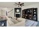Bright and spacious living room featuring a fireplace and large television set at 5306 Lavender Dr, Plainfield, IN 46168