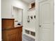 Convenient mudroom with bench, storage baskets, and access to the laundry room at 5306 Lavender Dr, Plainfield, IN 46168