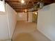 Spacious basement featuring open ceilings, painted walls, and sealed floors at 5430 E 17Th St, Indianapolis, IN 46218