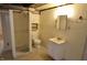 Cozy basement bathroom with shower, toilet, vanity and mirror at 5430 E 17Th St, Indianapolis, IN 46218