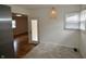 Cozy dining area with new floors, a window for natural light, and a view of the living room at 5430 E 17Th St, Indianapolis, IN 46218