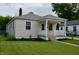 Charming single-story home with a front porch, manicured lawn, and fresh landscaping at 5430 E 17Th St, Indianapolis, IN 46218
