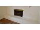 Bright white brick fireplace with hearth and metal screen at 5430 E 17Th St, Indianapolis, IN 46218