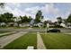 Street view of a quiet residential neighborhood with well-maintained homes and mature trees at 5430 E 17Th St, Indianapolis, IN 46218