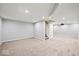 Spacious basement with neutral carpeting, recessed lighting, and access to the upper level at 5960 Dado Dr, Noblesville, IN 46062