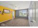 Bedroom featuring two-tone walls, carpet, and natural light from a window at 5960 Dado Dr, Noblesville, IN 46062