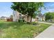 Beautiful home exterior with a lush green lawn, mature tree, and well-maintained landscaping at 5960 Dado Dr, Noblesville, IN 46062