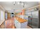 Open concept living space with kitchen, living room, and fireplace feature at 5960 Dado Dr, Noblesville, IN 46062