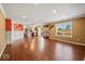 Expansive living space with hardwood floors, an open layout, and large windows providing natural light at 5960 Dado Dr, Noblesville, IN 46062