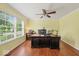 Bright home office featuring a large window, neutral walls, ceiling fan, and hardwood floors at 5960 Dado Dr, Noblesville, IN 46062