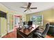 Comfortable home office featuring a large window, a ceiling fan, and ample workspace at 5960 Dado Dr, Noblesville, IN 46062