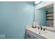 Stylish half bathroom with modern sink, mirror, and decor at 5960 Dado Dr, Noblesville, IN 46062